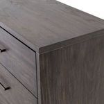 Close-up of wood grain and iron drawer handles with matte black finish