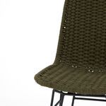 Angled view of woven rope seat and black metal frame with visible texture