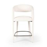 Hawkins Bar + Counter Stool with curved back and seat upholstered in high-performance off-white fabric, black metal footrest.