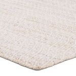 Close-up corner view showing soft woven texture and durable edge stitching of the rug