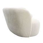 Side angle showing the sofa’s thick cushioned back and textured upholstery