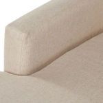 Close-up of sectional arm and chaise intersection showing fabric texture