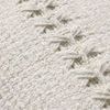 close-up detail of the woven stripe stitching and textured fabric on the pillow front
