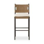 Outdoor bar stool with bronzed aluminum frame, all-weather woven wicker seat, and beige top cushion