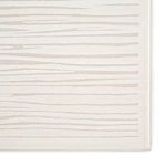 Close-up detail of bark-inspired lines in high-low texture rug pattern on white and ivory tones
