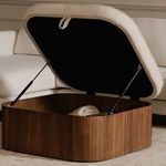 Sonny ottoman open in a living room setting next to sofa with storage compartment revealed