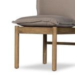 Close-up of wooden legs and frame showing natural acacia finish with floor protectors