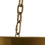 Close-up of brass chain links connecting the hanging pendant