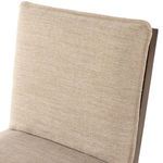 Close-up of upper backrest upholstery with slight fabric texture visible