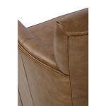 Close-up showing top corner of chair's rear with smooth stitches and soft cushioned back