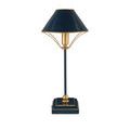Smaller navy-blue lamp with gold trim and brass details shown angled left on plain background