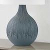 Speckled blue ceramic Nepperhand table lamp with drip-like carved striation pattern and white linen drum shade