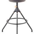 Akron counter stool with round dark leather seat, black cast-iron frame, brass adjustment knob, and circular footrest