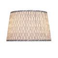 Side view of Plume lamp shade illuminated, emphasizing pleating and pattern consistency