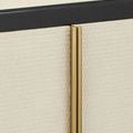 Close-up of woven raffia texture on door fronts with gold vertical trim and black wood frame