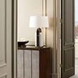 Harper Console shown in room corner with decorative lamp and bowl on top, soft beige walls in background
