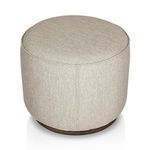 Top-down angled view of rounded ottoman showing circular top and fabric weave