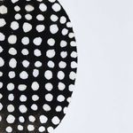 Zoomed portion of the diptych showing imperfections and texture on black and white dots