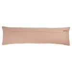 Back side of lumbar pillow showing blush cotton fabric with small brand label on right corner