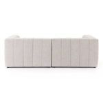 Close-up showing fine vertical fabric texture and seam on sandstone upholstery