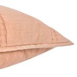 Close-up of fabric texture and side seam stitching on taupe beige sham