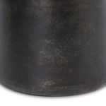 Close detailed view of the base showing dark bronze with textured finish and subtle weathering