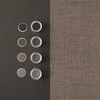 Rustic Weft Wallpaper beside dark mat surface with open paint cans and color swatches