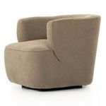 Rear angled close-up highlighting upholstery curves and fabric detail