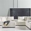 Lucca Modular Sectional styled in modern living room with grey walls and abstract black artwork