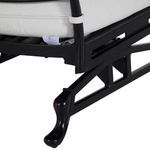 Repeated close-up of black chair leg with sculpted foot and slatted seat frame