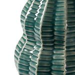 Close-up of Quinn Lamp ceramic base showing glossy textured vertical ridges and veridian green glaze