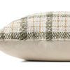 Side view showing the pillow’s solid ivory fabric back contrasting the textured plaid front