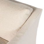 Close-up detail of slipcover seam and cushioned backrest edge of the Delray Swivel Chair