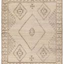 Taupe handknotted wool rug with open tribal medallion and geometric patterns in soft cream and brown