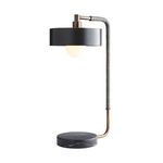 Black drum shade with illuminated bulb viewed from front and slightly angled