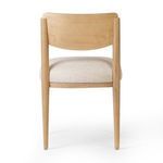 Rear view highlighting smooth wooden backrest and slender legs