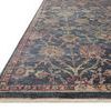 angled close-up showing fringed edge with detailed floral pattern and textured pile
