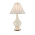 Close-up showing ivory fabric shade pleats and brass finial top detail