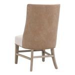 Rear three-quarter view of Duet Head Chair showing full tan upholstery back and wooden legs with stretchers