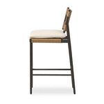 Side profile highlighting slim bronzed frame and seat cushion thickness