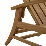 Close-up on curved teak armrest and side frame showing smooth slats and joinery details.