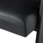 Close-up on leather seat cushion showcasing smooth texture and detailed stitching