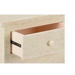 Close-up of an open drawer showing bone fish scale pattern on drawer front and round knob detail