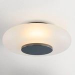 Another view of the flush mount illuminated, highlighting the soft light diffusion through the frosted glass