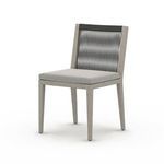 Three-quarter angle of Sherwood Grey chair emphasizing gray cushion and rope back contrast