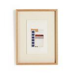 Framed collage with vertical composition of tan, rust, blue, and cream fabric swatches in oak frame