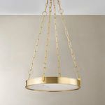 Full front view showing drum pendant and chain linkage against taupe wall