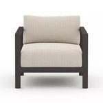 Front view focusing on thick seat and back cushions with textured neutral fabric on Sonoma Faye Sand Outdoor Chair