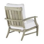 Side angle emphasizing outward curving armrest and thick white cushion on lounge chair