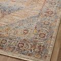 Detailed view of intricate geometric and floral pattern in muted sunset hues on textured surface
